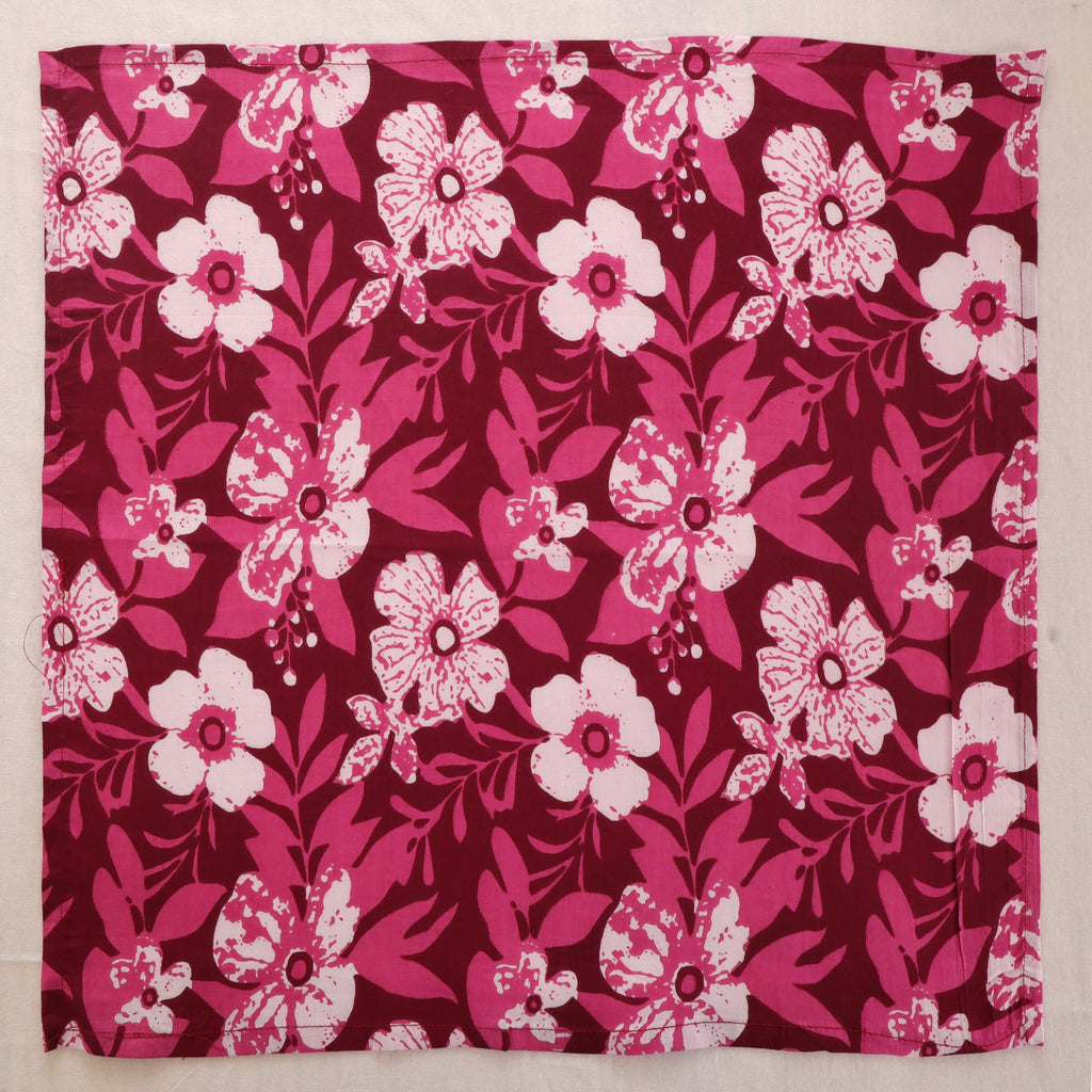Berry and white hand block print cotton napkin laid flat, full print visible