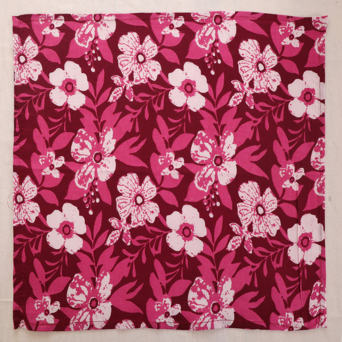 Berry and white hand block print cotton napkin laid flat, full print visible