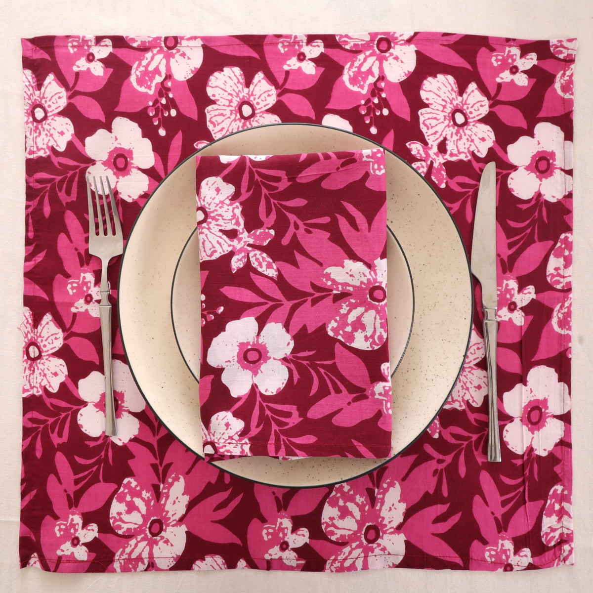 Berry and white block print napkin set as a place setting with plate and cutlery