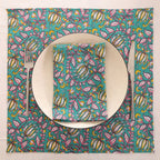 Teal and pink block print napkin set as a place setting with plate and cutlery
