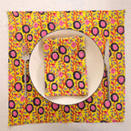 Chartreuse and pink block print napkin set as a place setting with plate and cutlery