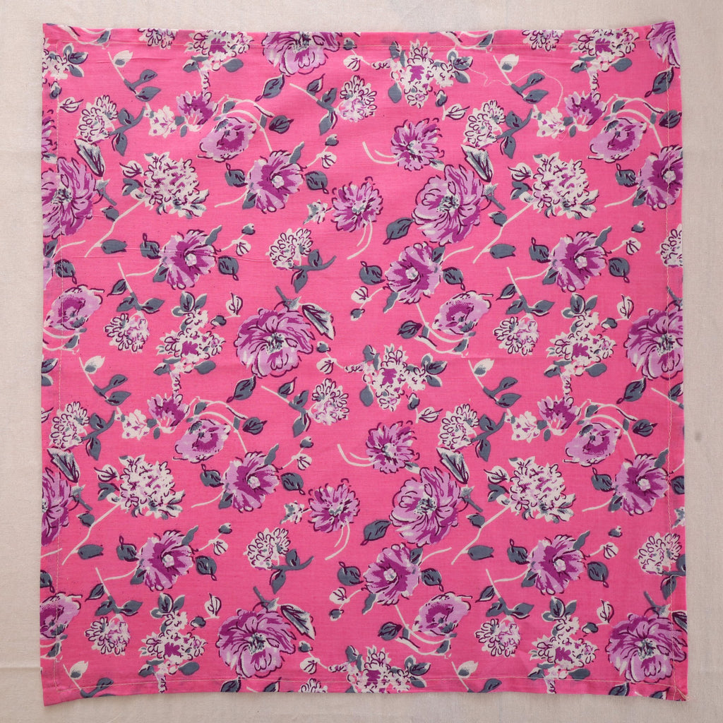 Pink and purple hand block print cotton napkin laid flat, full print visible