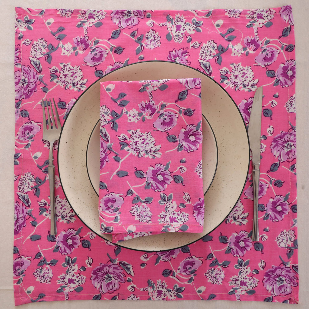 Pink and purple block print napkin set as a place setting with plate and cutlery