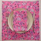 Pink and purple block print napkin set as a place setting with plate and cutlery