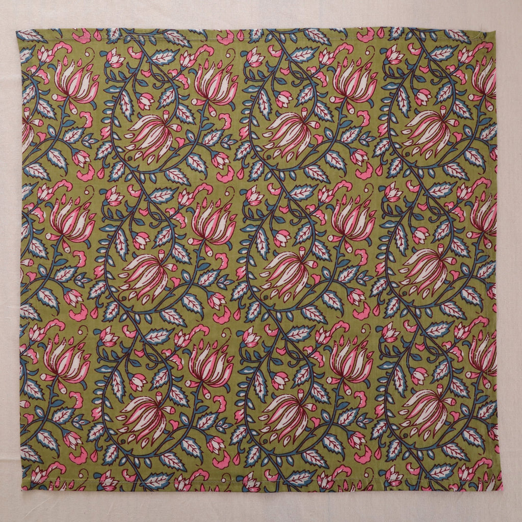 Olive and pink hand block print cotton napkin laid flat, full print visible