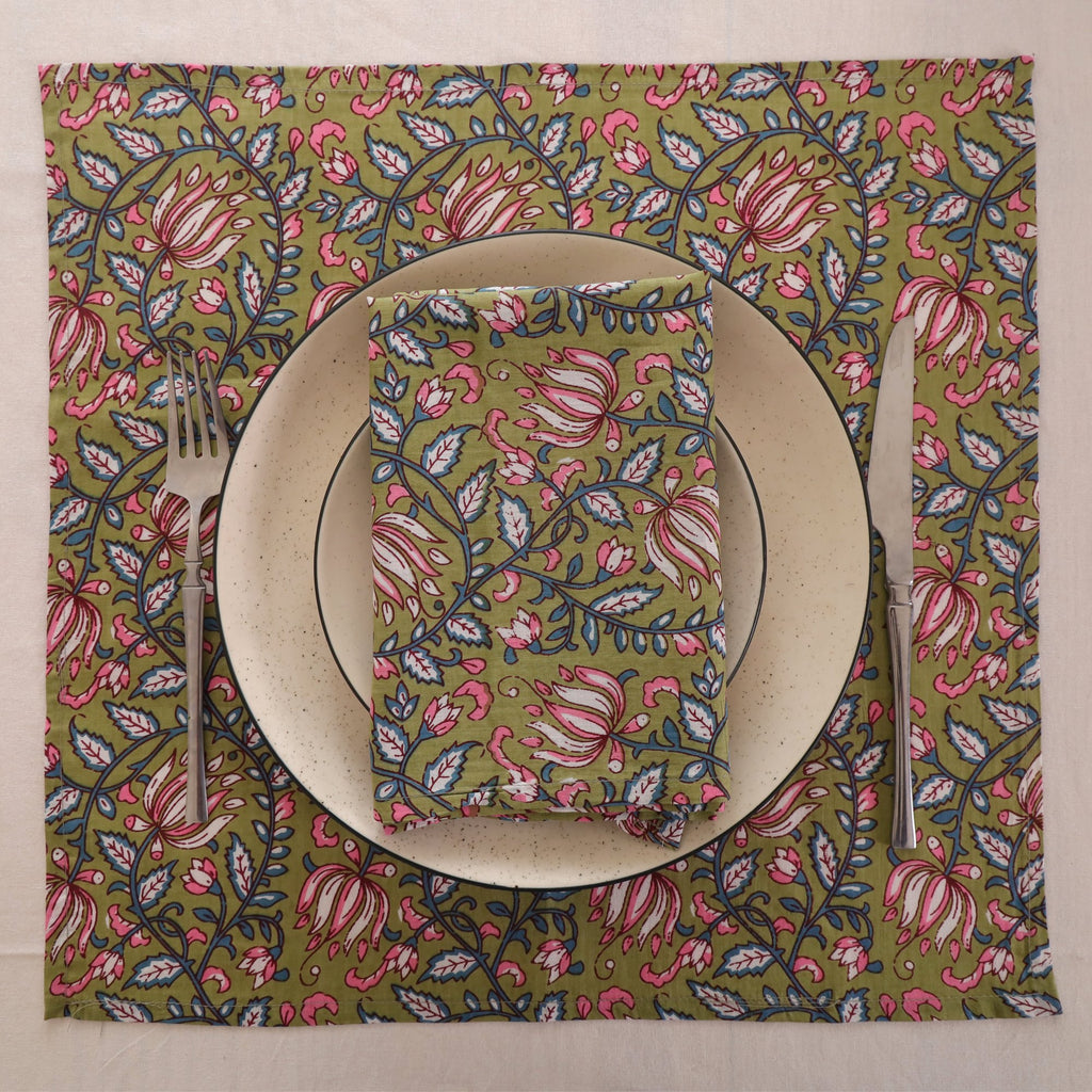 Olive and pink block print napkin set as a place setting with plate and cutlery