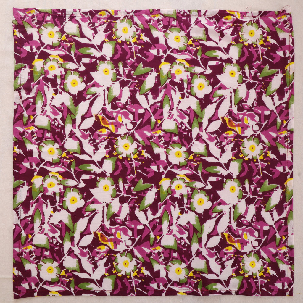 Purple and white hand block print cotton napkin laid flat, full print visible