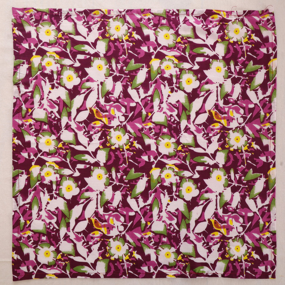 Purple and white hand block print cotton napkin laid flat, full print visible