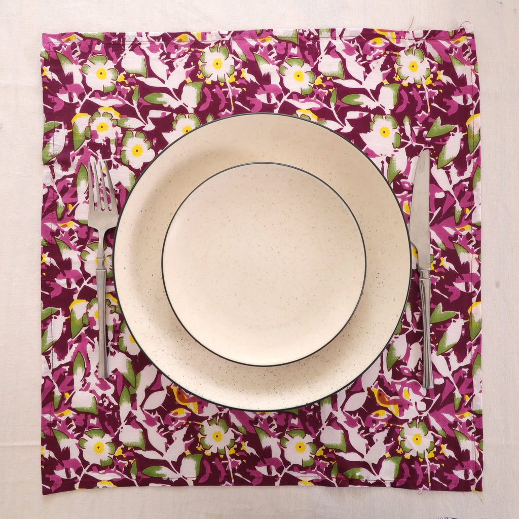 Purple and white block print napkin set as a place setting with plate and cutlery