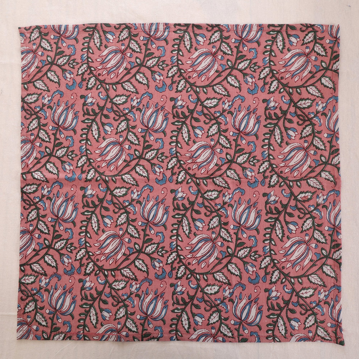 Dusty rose hand block print cotton napkin laid flat, full print visible