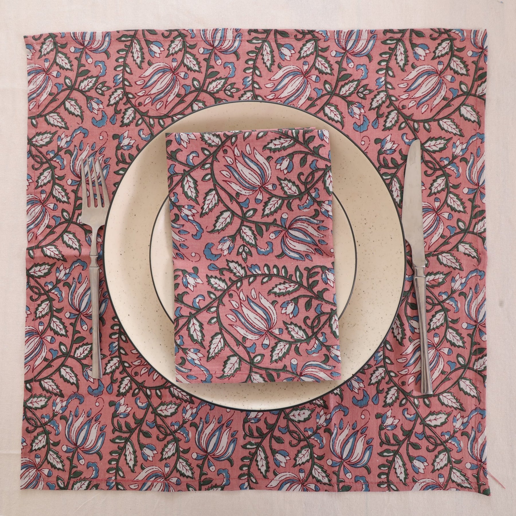 Dusty rose block print napkin set as a place setting with plate and cutlery