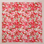 Red and cream hand block print cotton napkin laid flat, full print visible