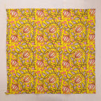 Yellow and pink paisley hand block print cotton napkin laid flat, full print visible