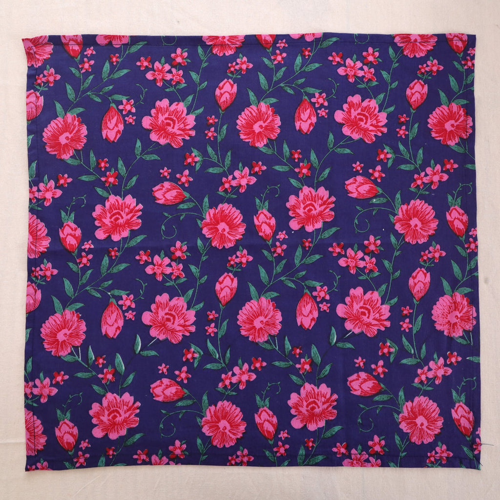 Navy and pink hand block print cotton napkin laid flat, full print visible