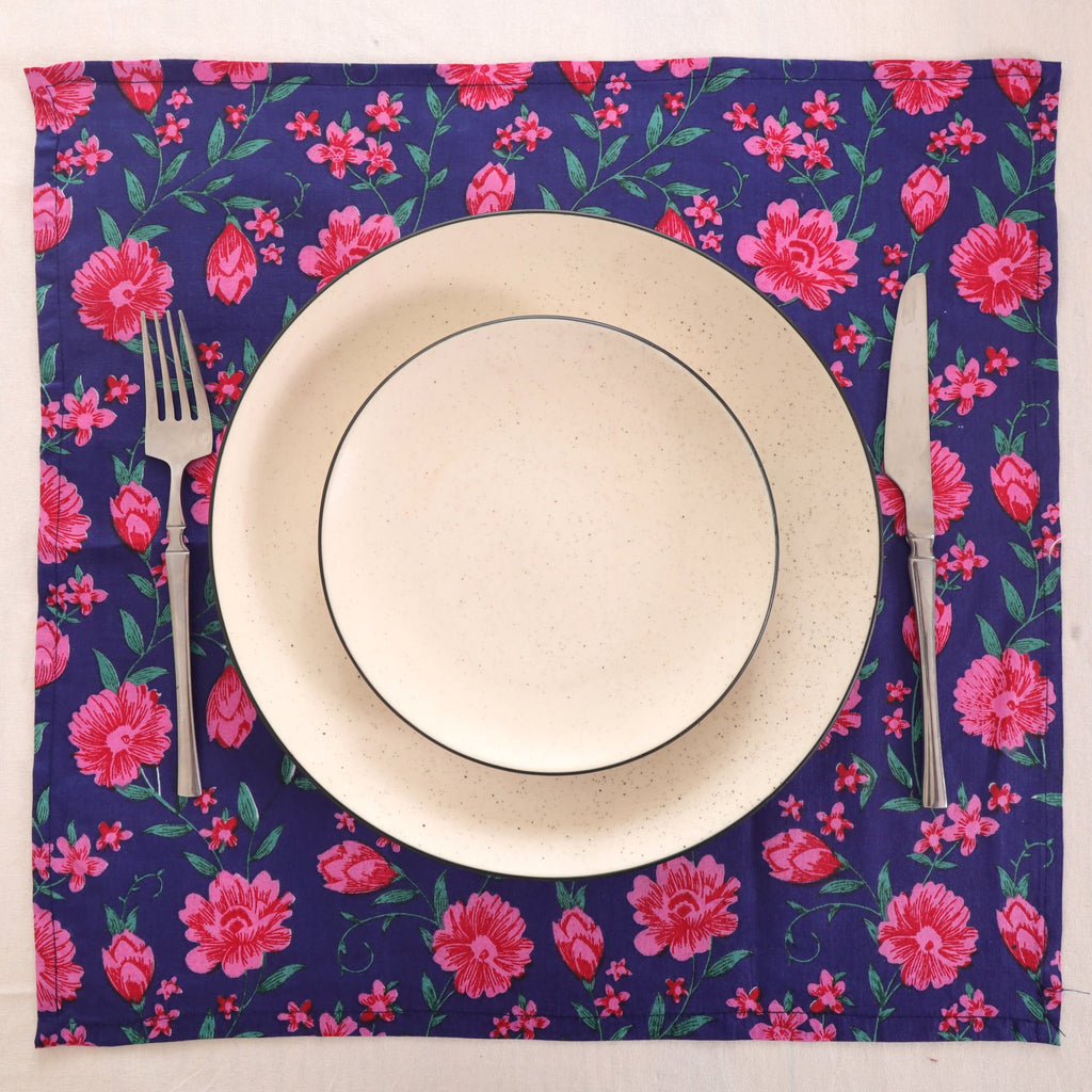 Navy and pink block print napkin set as a place setting with plate and cutlery