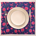 Navy and pink block print napkin set as a place setting with plate and cutlery